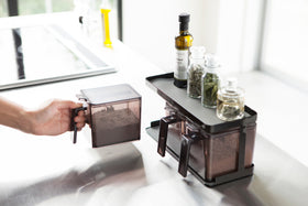 Black Pantry Organizer holding baking ingredients and spices on upper shelf by Yamazaki Home. view 21