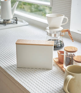 Front view of closed white Size 01 + 02 Wood-Accent Coffee Filter in kitchen by Yamazaki Home. view 2