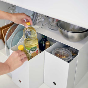 Yamazaki White Under-Cabinet Storage Shelves holding kitchen essentials. view 6